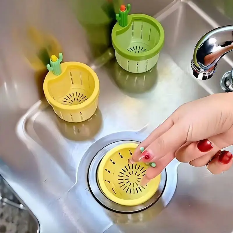 A Person is Placing Cute Kitchen Sink Drainer in a Sink.