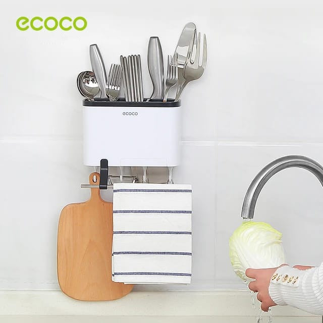Someone cleaning something next to the Ecoco Utensil Storage Rack
