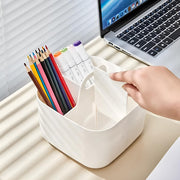 A Hand is arranging the Desk Organizer organized with stationaries.