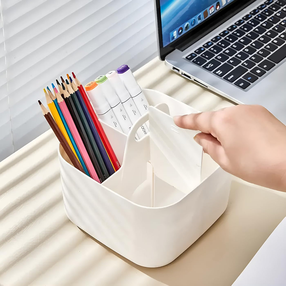 A Hand is arranging the Desk Organizer organized with stationaries.