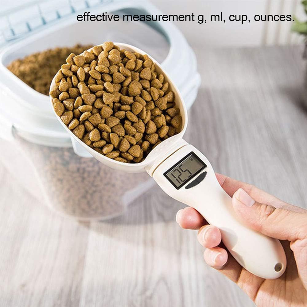 A person is holding Digital Measuring Spoon Scale with pet food.