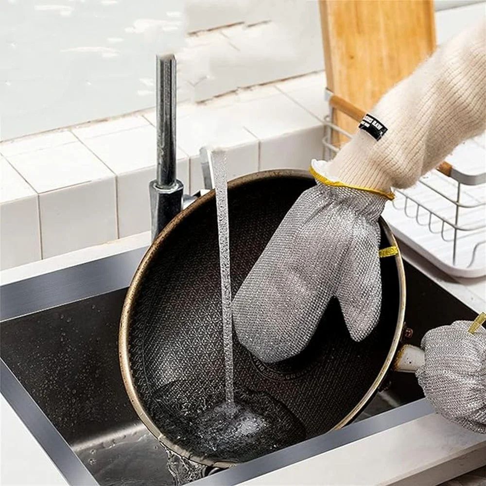 A Person is Cleaning Dishes by Wearing Dishwashing Kitchen Cleaning Wire Gloves.