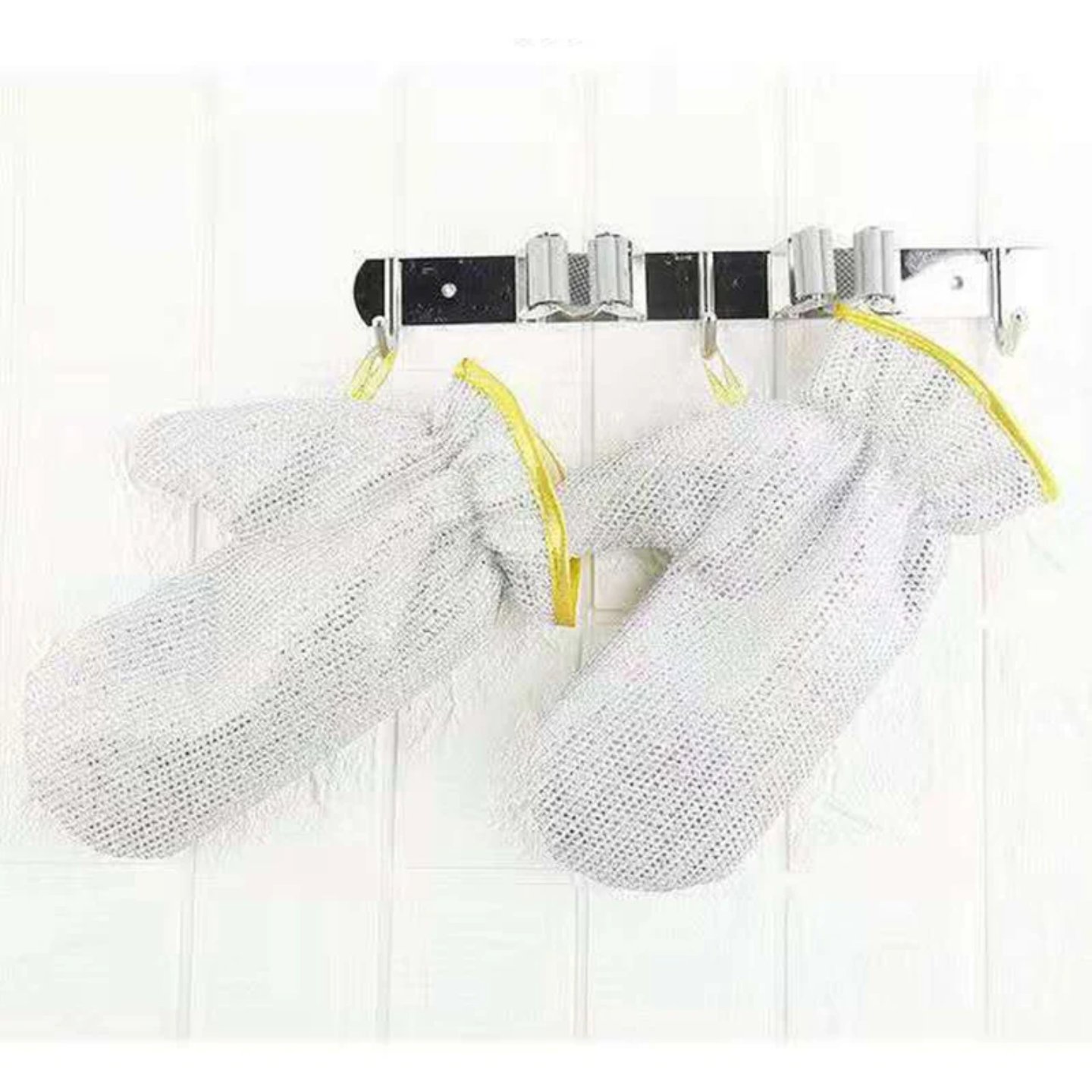 Dishwashing Kitchen Cleaning Wire Glovess Hanged on the Wall Hanger.