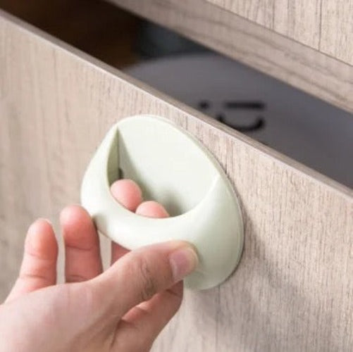 A Person is Opening a Wardrobe Using Multi-functional Door Handle Sticked On it.