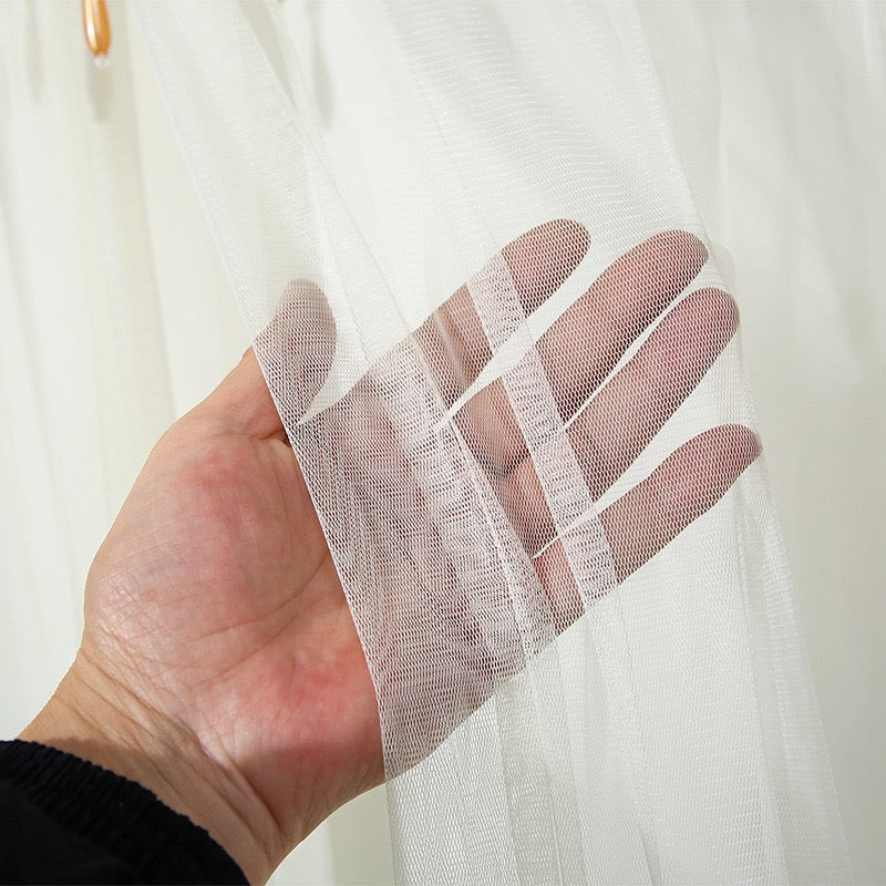 A Man is Holding Double-Layered Lace Curtains.