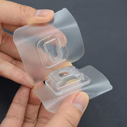 A Hand is holding Double Sided Self Adhesive Wall Hooks