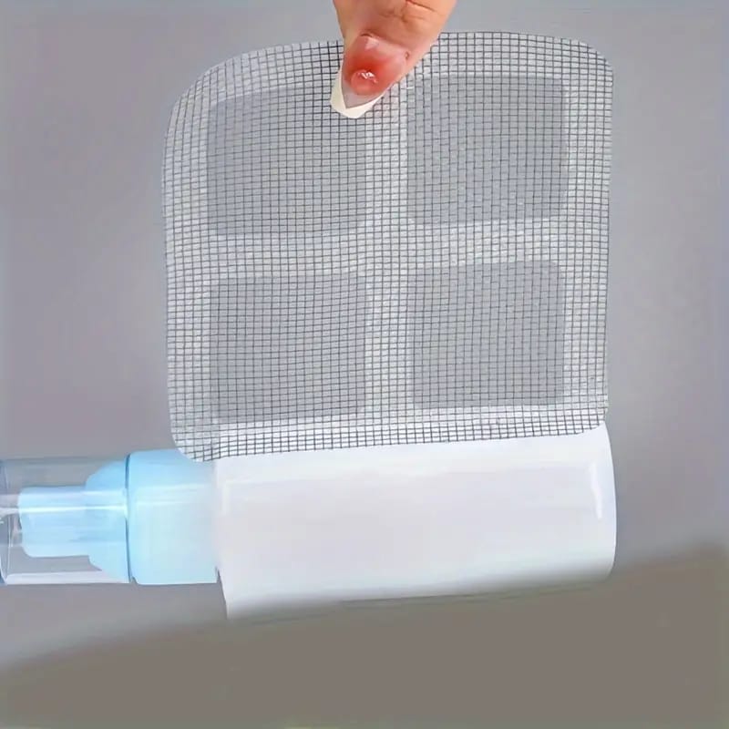 A Person is Holding Drain Hair Catcher Mesh Sticker.