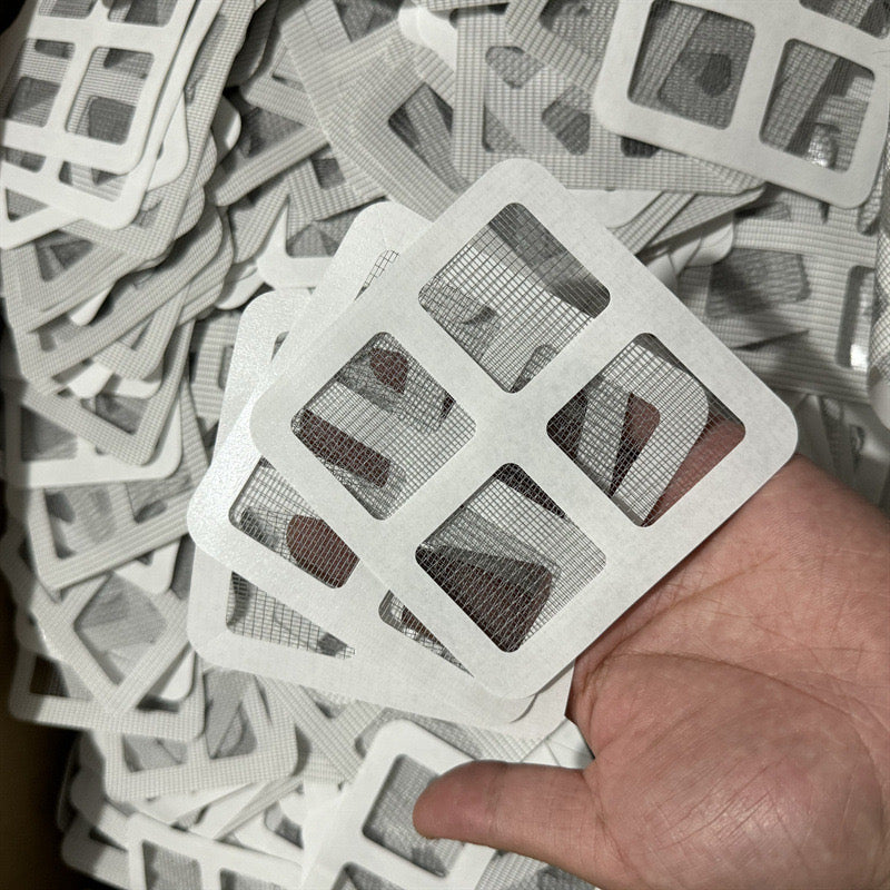 A Person is Holding Drain Hair Catcher Mesh Sticker.