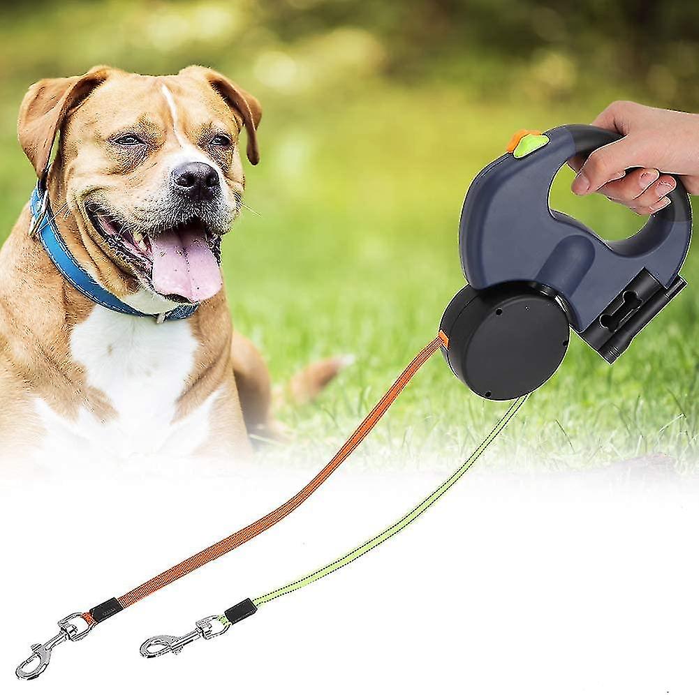 A Person is holding Dual Retractable Dog Leash.