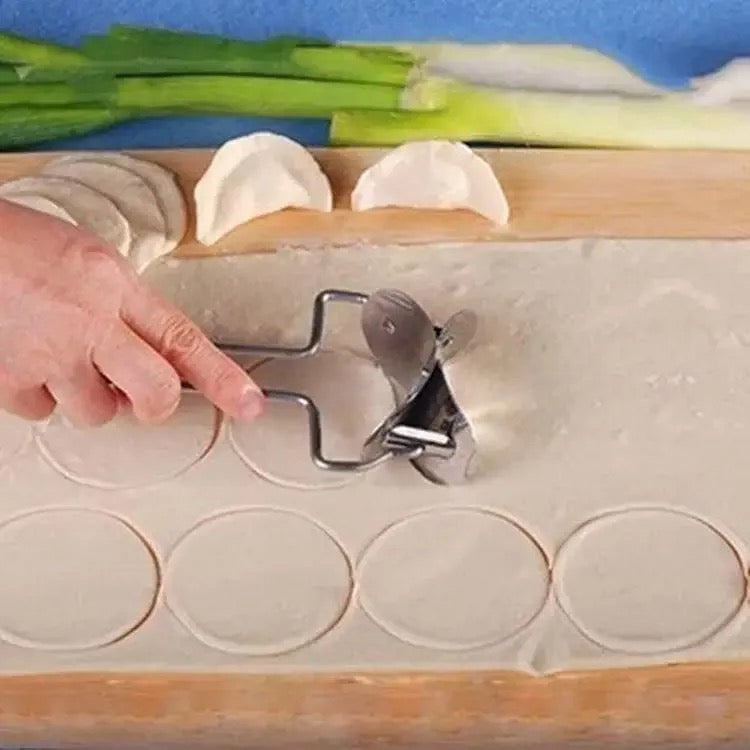 A Person is Rolling Dough Using Stainless Steel Dumpling Wrapper Maker.