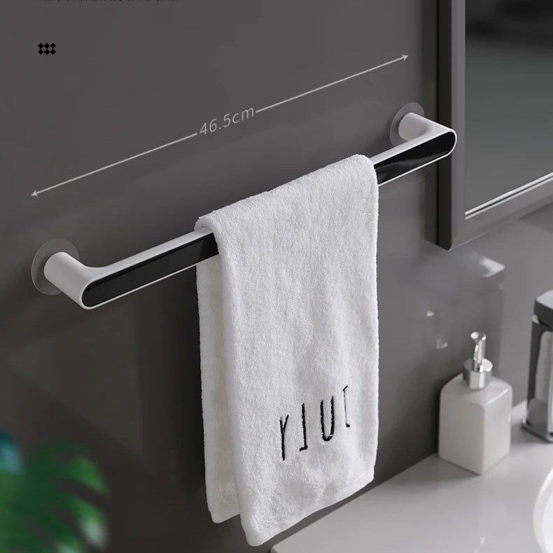 A towel is organized on the Towel Organizer Hanger in black color