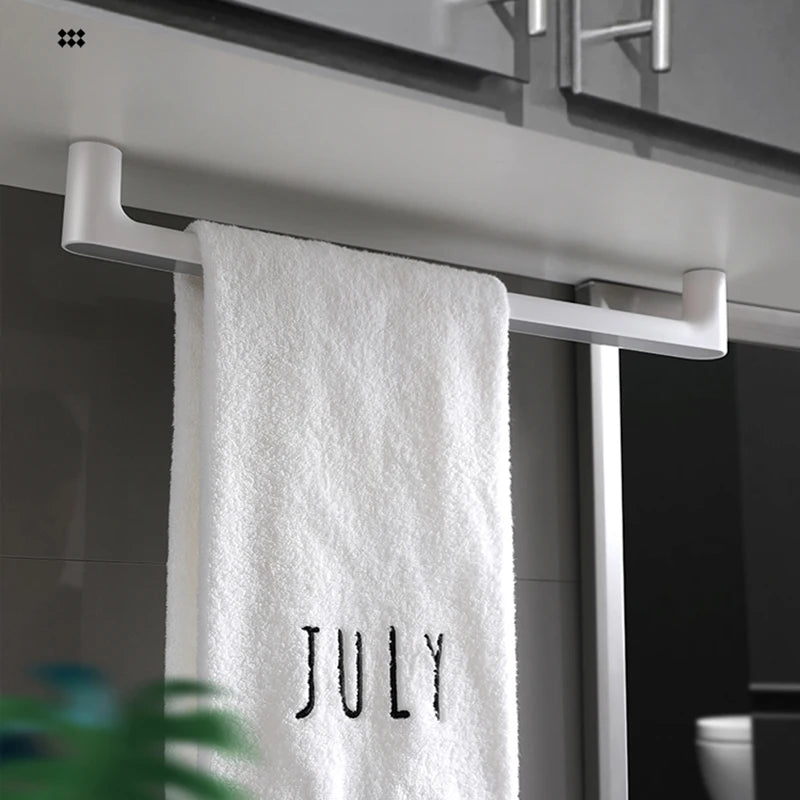 A towel is organized on the Towel Organizer Hanger in gray color