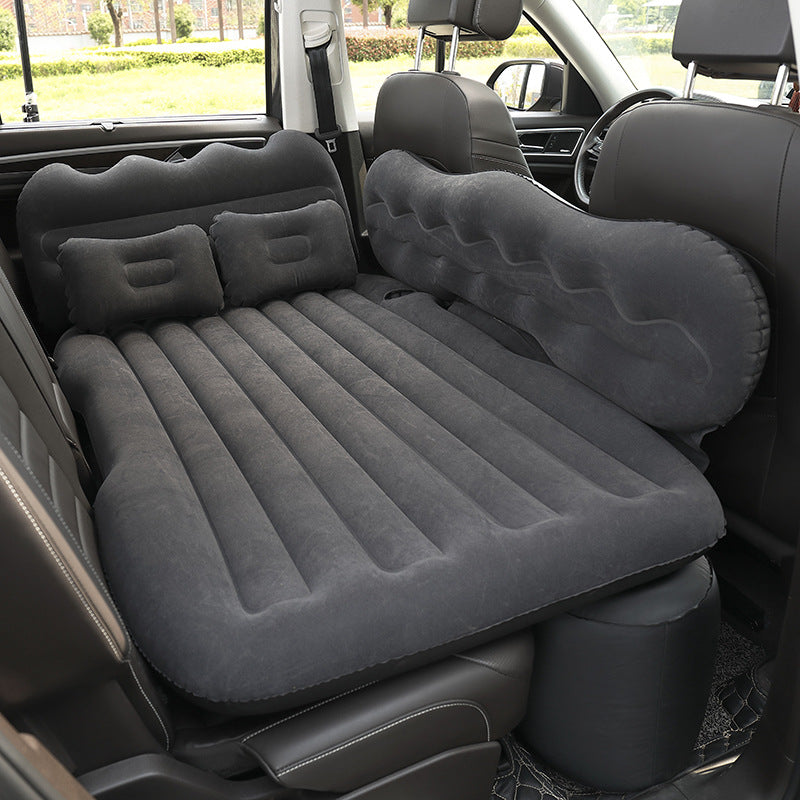 Black Portable Travel Inflatable Car Bed placed in a car
