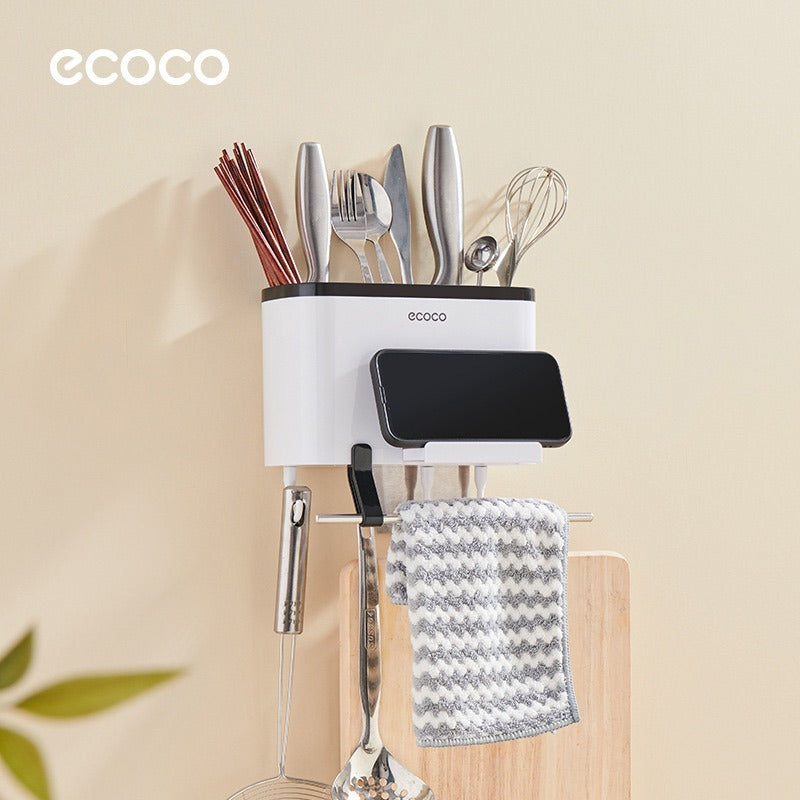 Ecoco Utensil Storage Rack placed on the wall with some items in it