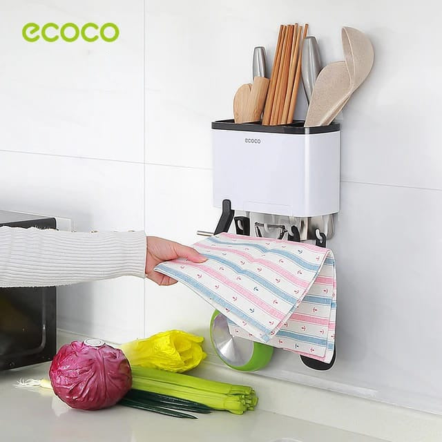 Someone taking a towel from Ecoco Utensil Storage Rack
