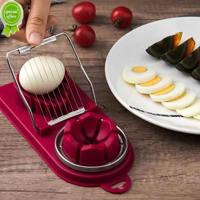 A Person is Cutting Egg Using Egg Cutter Kitchen Gadgets 