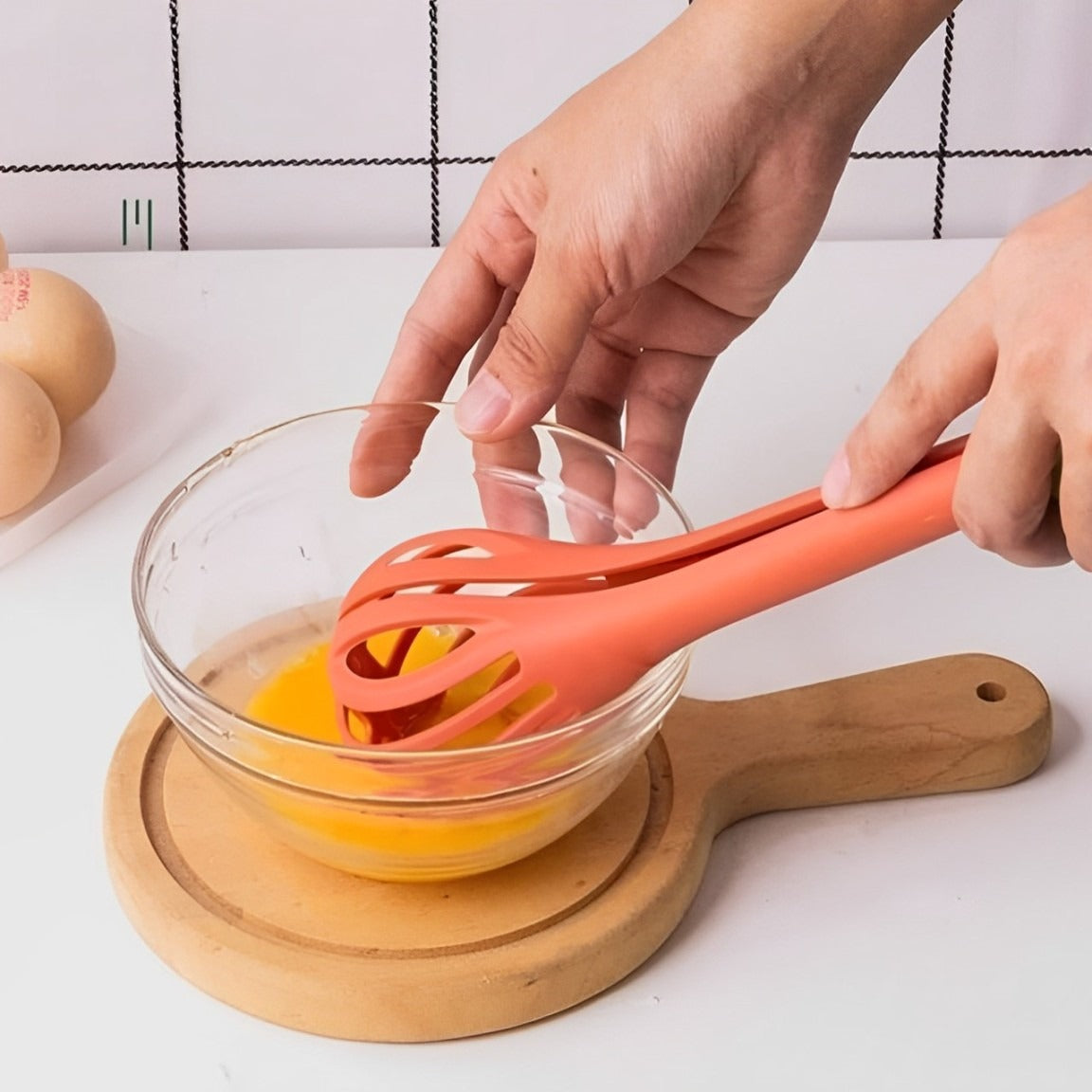 A Person Beats Egg Using Multi-purpose Manual Kitchen Whisk.