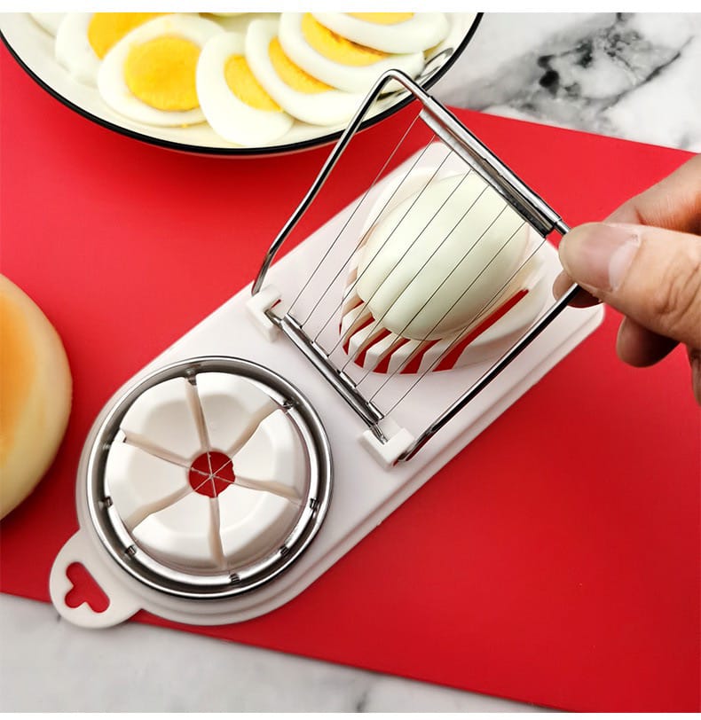 A Person is Slicing Egg Using Heavy Duty Manual Egg Slicer