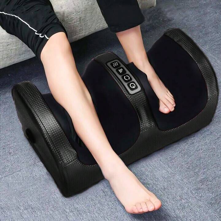 A Person is Massaging Leg Using Electric Foot Massager.