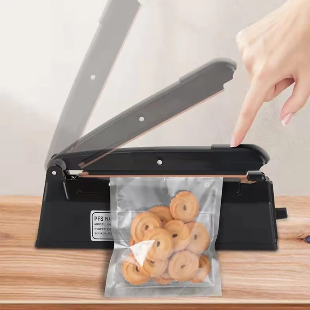 A Person is Sealing a Bag With Food Items Using Electric Heat Impulse Plastic Bag Sealer.