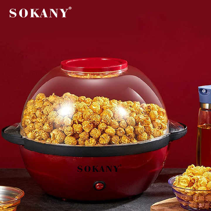 Electric Popcorn Maker With Popcorn in it.