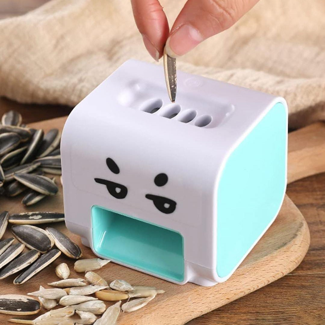 A Man is Placing Seed On Electric Seed Peeler.