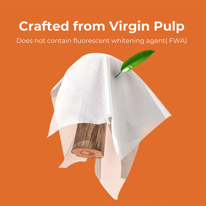 A white textured Extra Soft Tissue towel or napkin draped over a small wooden block, with a green leaf tucked into the top edge, set against a solid orange background with text reading 'Crafted from Virgin Pulp' and 'Does not contain fluorescent whitening agent (FWA)'.