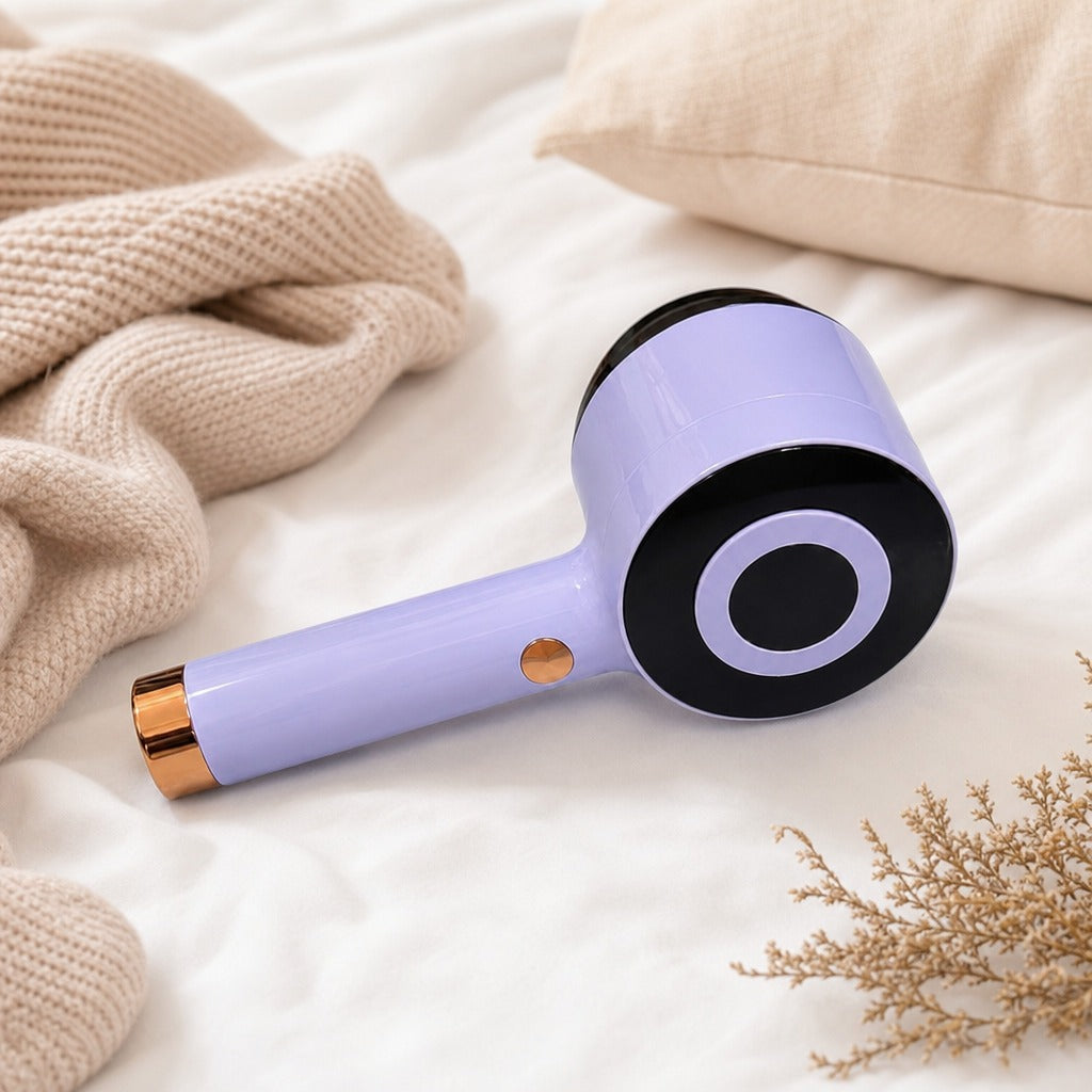 Fabric Lint Remover on a soft surface with beige blanket and dried flowers