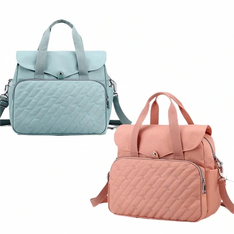A Fashionable Baby Diaper Bag In Two Colors.