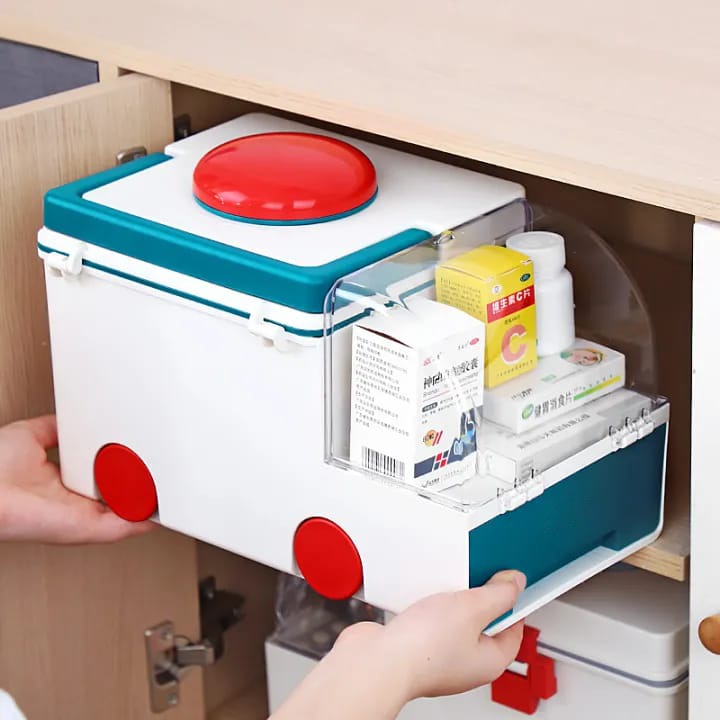 A Person is Keeping First Aid Kit Medicine Storage Box in a Shelf.