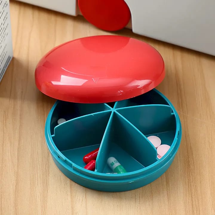 Upper Portion Of First Aid Kit Medicine Storage Box With Tablets in it.