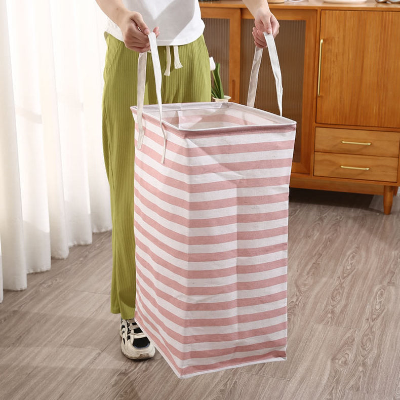 A Women Holds Foldable Cloth Storage Laundry Bin.