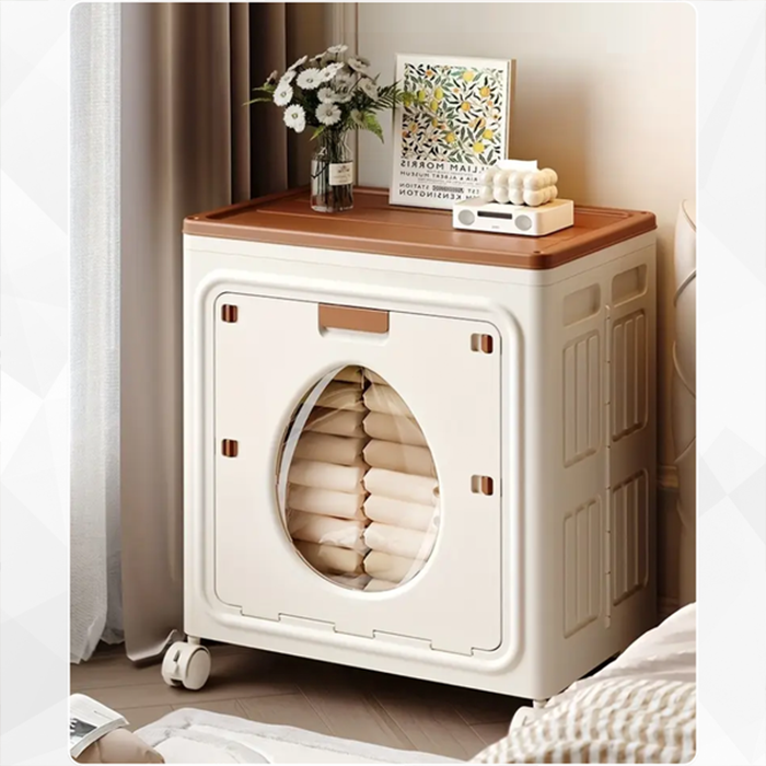 A Foldable Cloth Storage Organizer Box is kept on the side of modern room neatly filled with folded clothes.