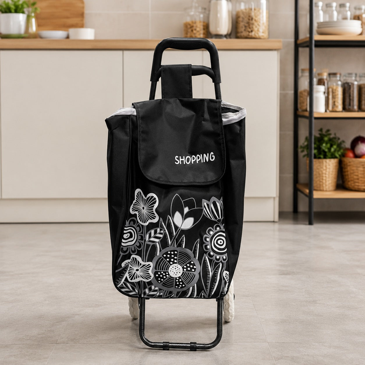 A Foldable Shopping Bag Trolley Cart with a floral white line-art print and the word 'SHOPPING' on the front, shown in a kitchen setting.