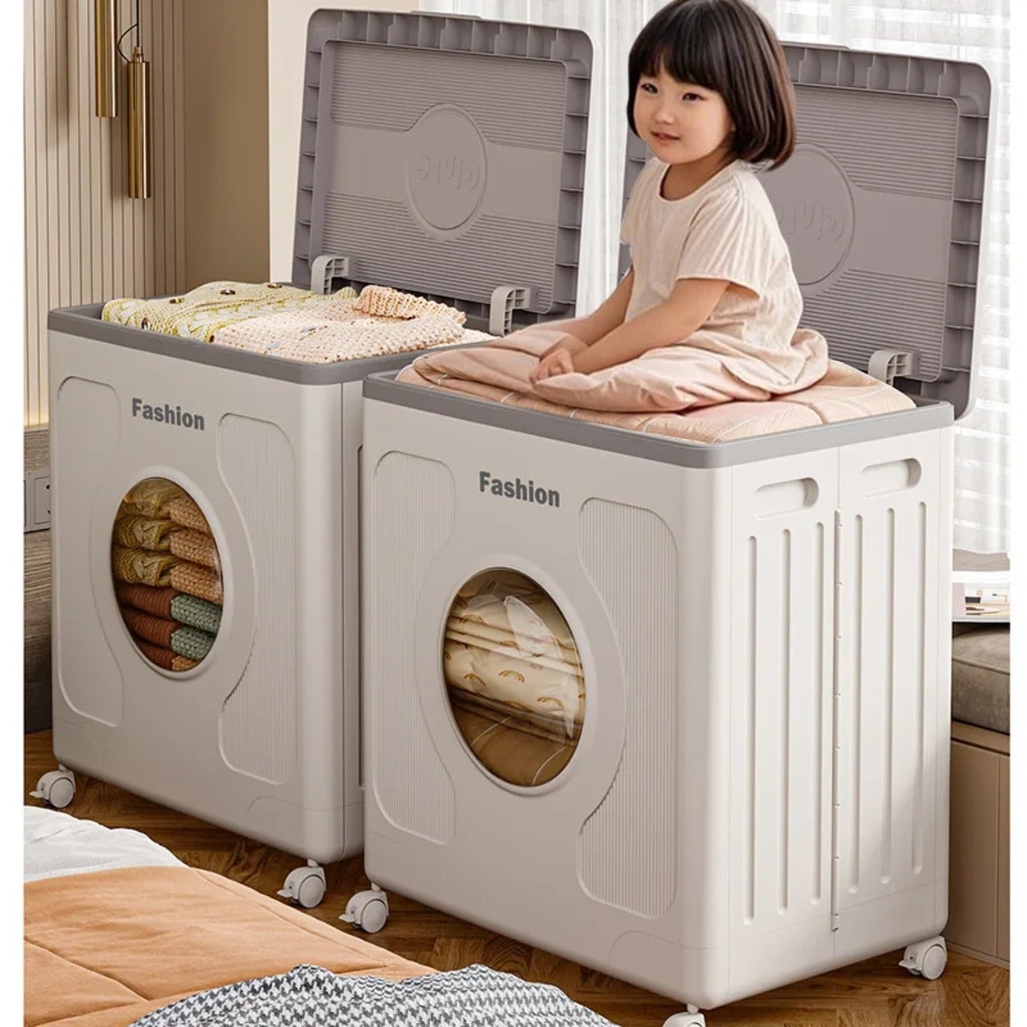 A Baby is Sitting Over Foldable Storage Organizer Box Organized with Clothes.