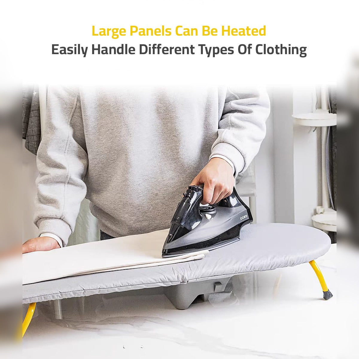 A Person is Ironing in a Tabletop Foldable Ironing Board With Iron Holder