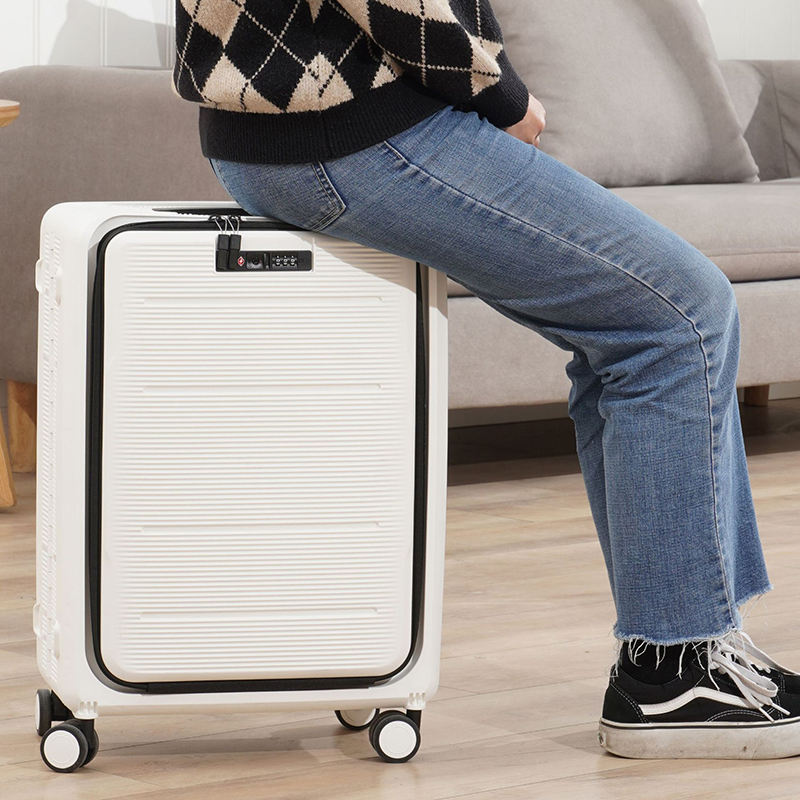 A Person is Sitting On the Foldable Travel Trolley Luggage Bag.