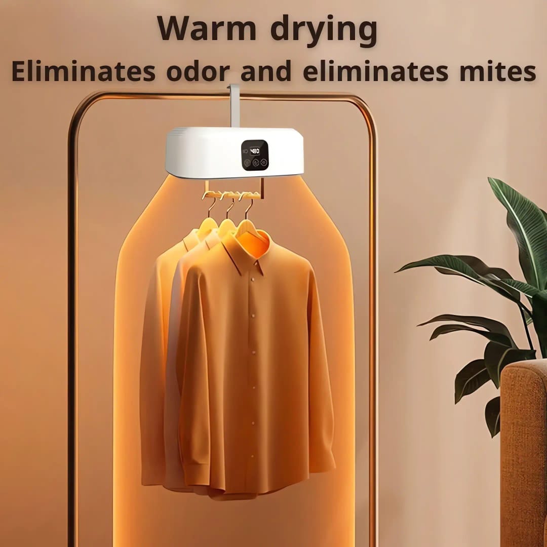 Folding Electric Cloth Dryer With Cloths Are Hanged On Cloth Rack.