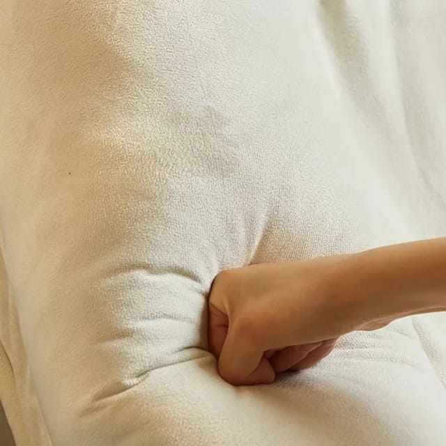 A Person is Pressing Folding Lazy Sofa.