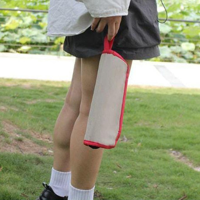 A Person is Holding Foldable Mini Stool.