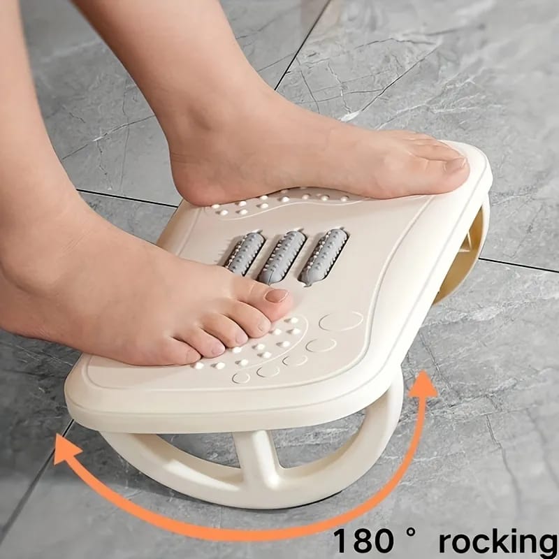 A Person is Placed His Leg On the Foot Massager Stool.