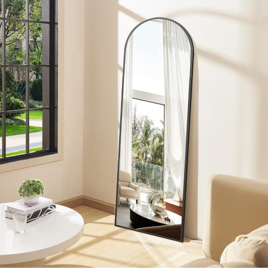 Full-Length Arched Standing Floor Mirror with Stand is Placed at the Corner Of Home.