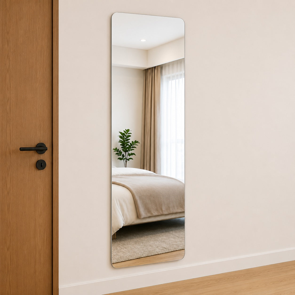 Full Length Self Adhesive Mirror Sticker leaning against a wall in a bedroom setting.