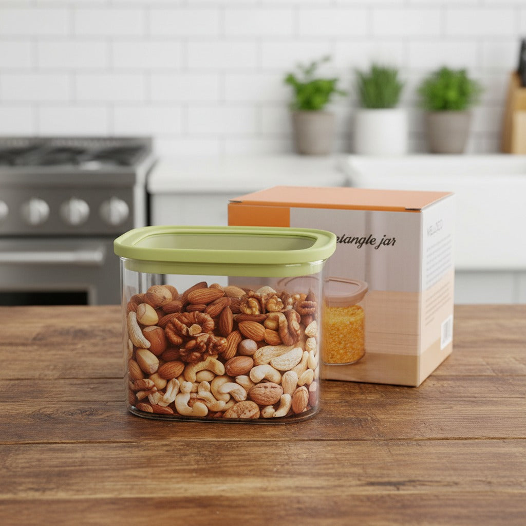 A Glass Storage Rectangle Jar filled with nuts and its pack kept on a Kitchen table.