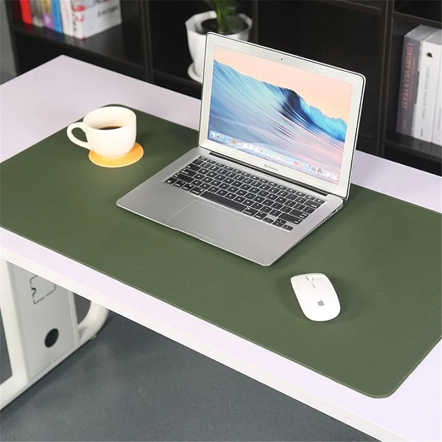 Laptop Is Placed On Large Green Laptop Desk Mouse Mat.