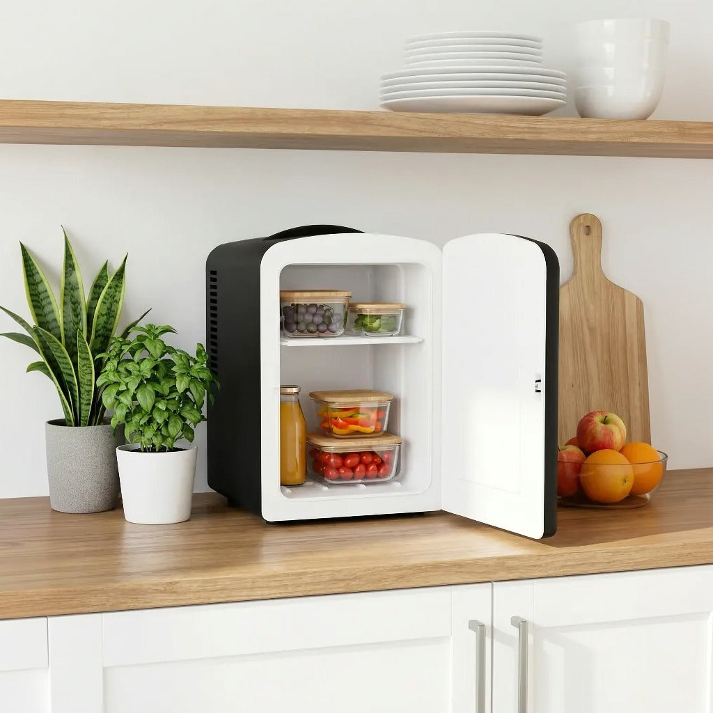 Green Lion 4L Mini Fridge on a kitchen counter with open door displaying food items.