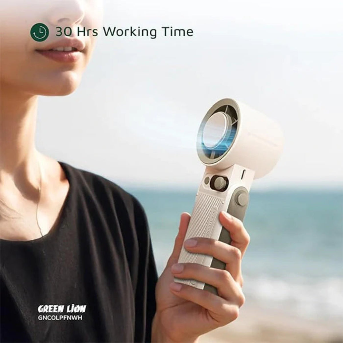 Person holding a Green Lion Coolio Portable Fan with '30 Hrs Working Time' text 