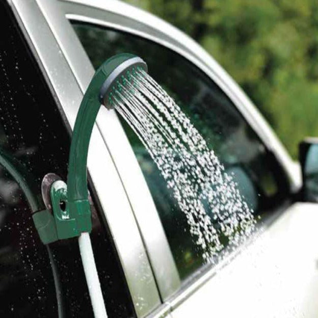 A Green Lion Rechargeable Outdoor Smart Shower is Attached On Car Window.