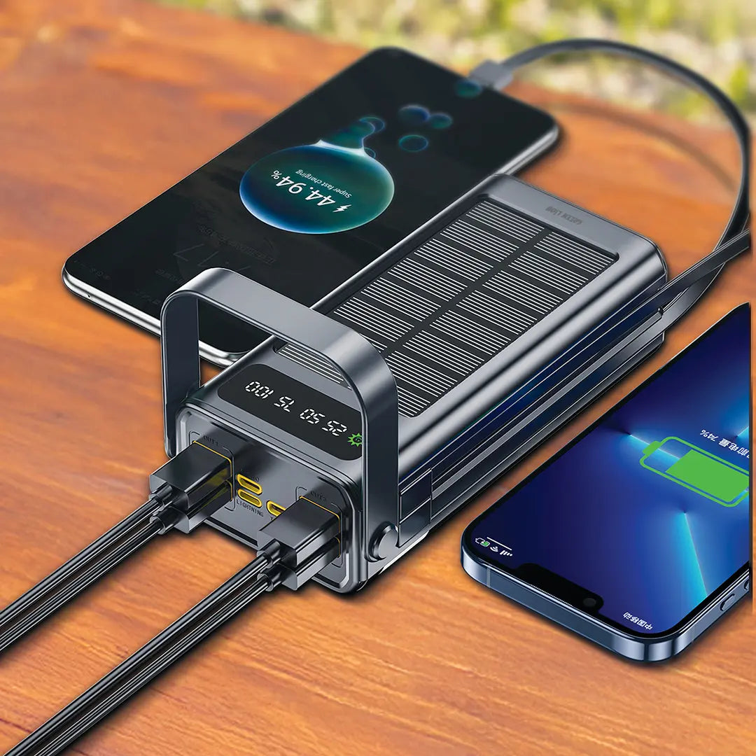 A Green Lion solar power bank charging multiple smartphones, featuring a digital display, built-in cables, and a solar panel design.