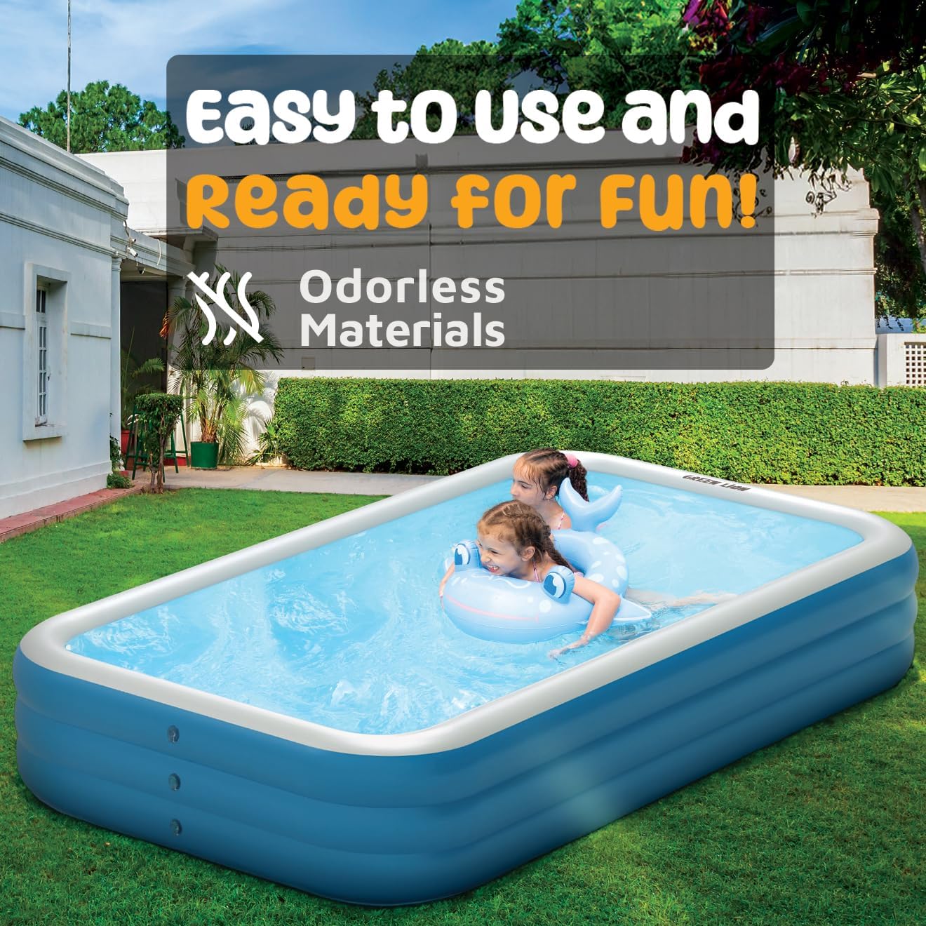 Two children are playing in a Green Lion Inflatable Pool placed in a garden. The pool is filled with clear water, and one of the kids is using a blue float